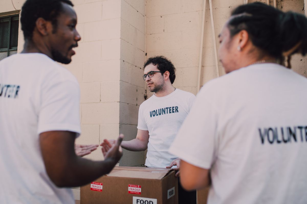 Volunteers organizing donations to give back to neighbors